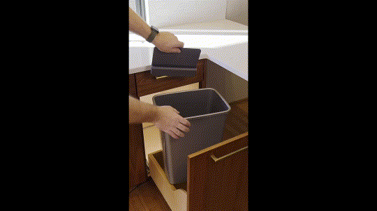 Animated clip showing Trash Shield being clipped onto the rim of a pull-out bin